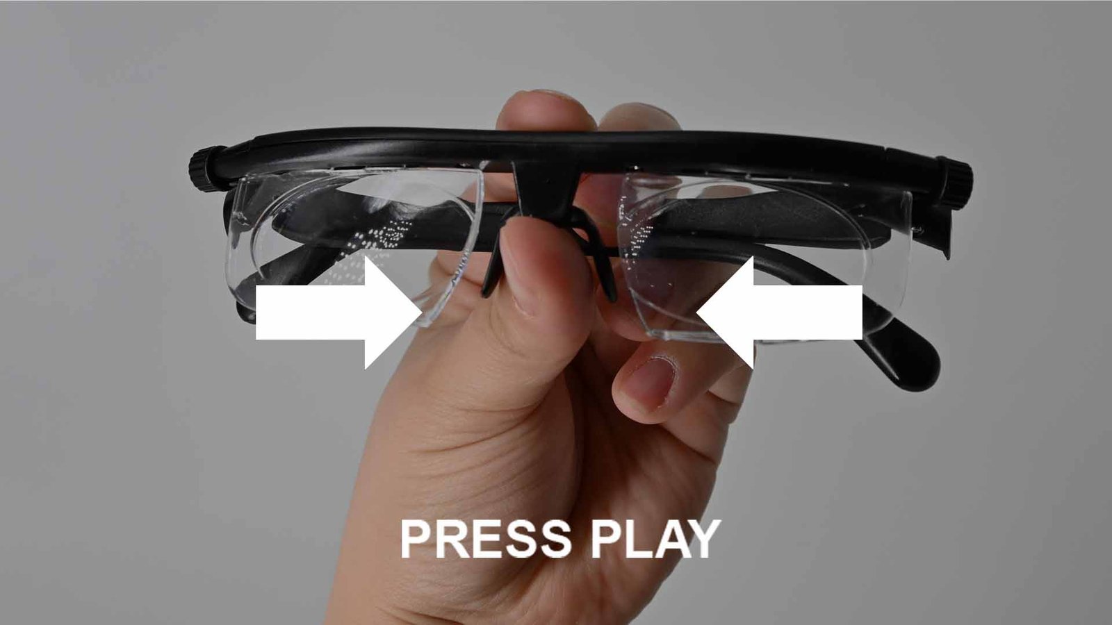 Close-up of side adjustment dials on adjustable glasses.